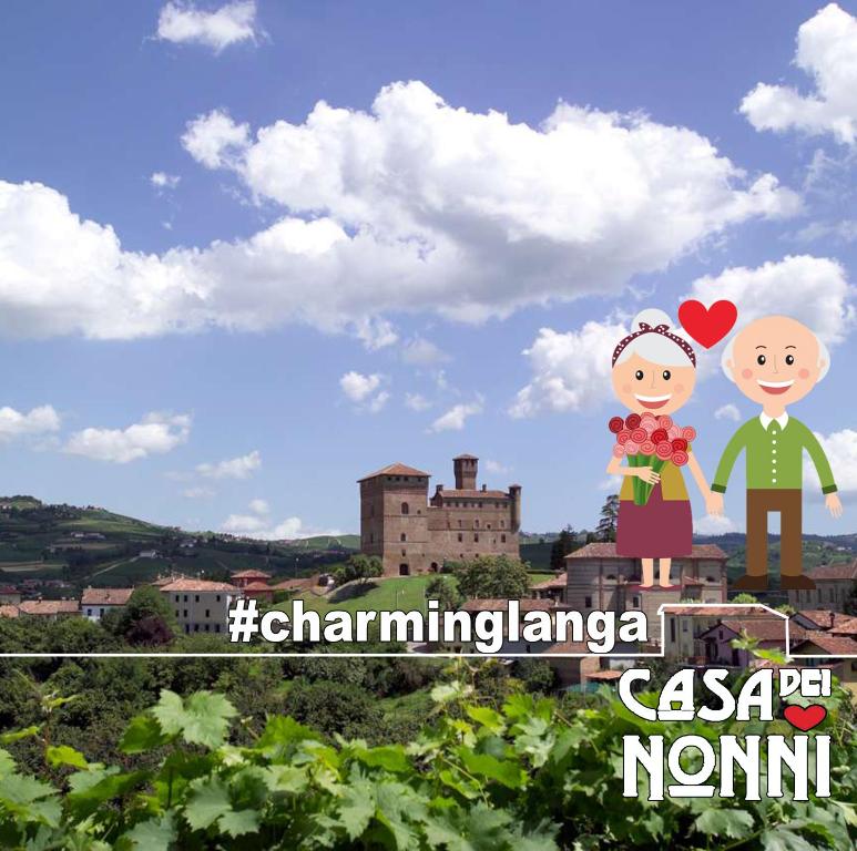 a picture of a couple standing on top of a vineyard at Casa dei Nonni #charminglanga in Grinzane Cavour