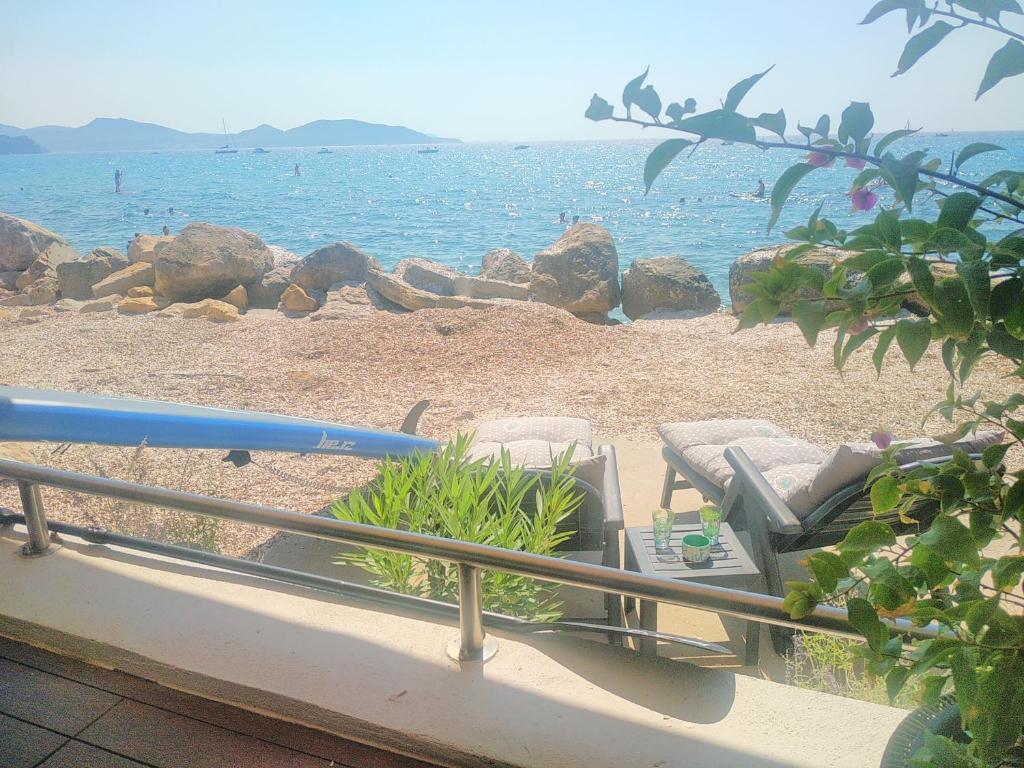 a balcony with a view of the beach at A l' orée de l'ô in La Ciotat