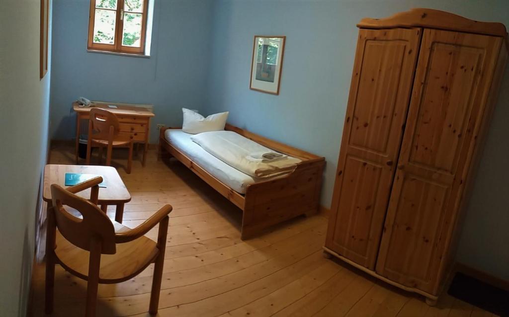 Postel nebo postele na pokoji v ubytování Hotel Gasthaus Weisser Mönch