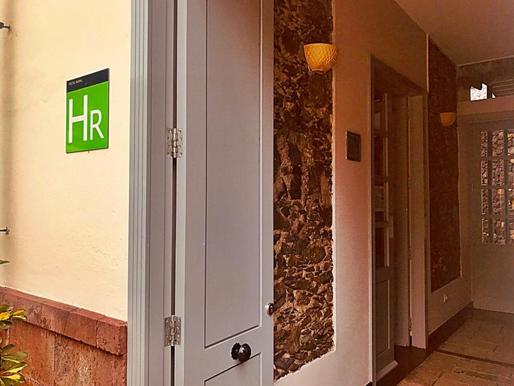 a entrance to a building with a hr sign on the wall at Hotel Rural Triana in Vallehermoso