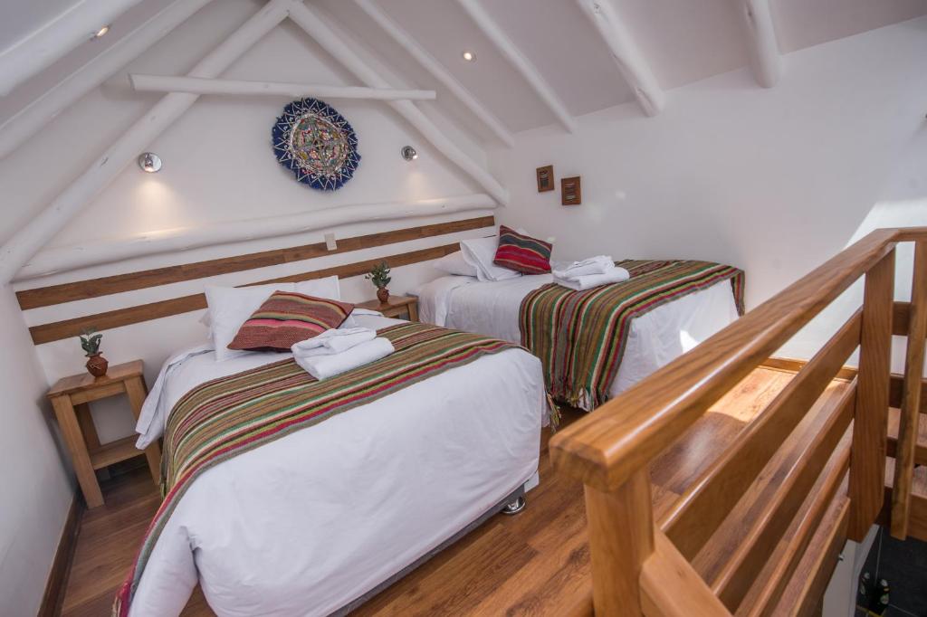 Postel nebo postele na pokoji v ubytování Casa Cavassa Centro Histórico Cusco