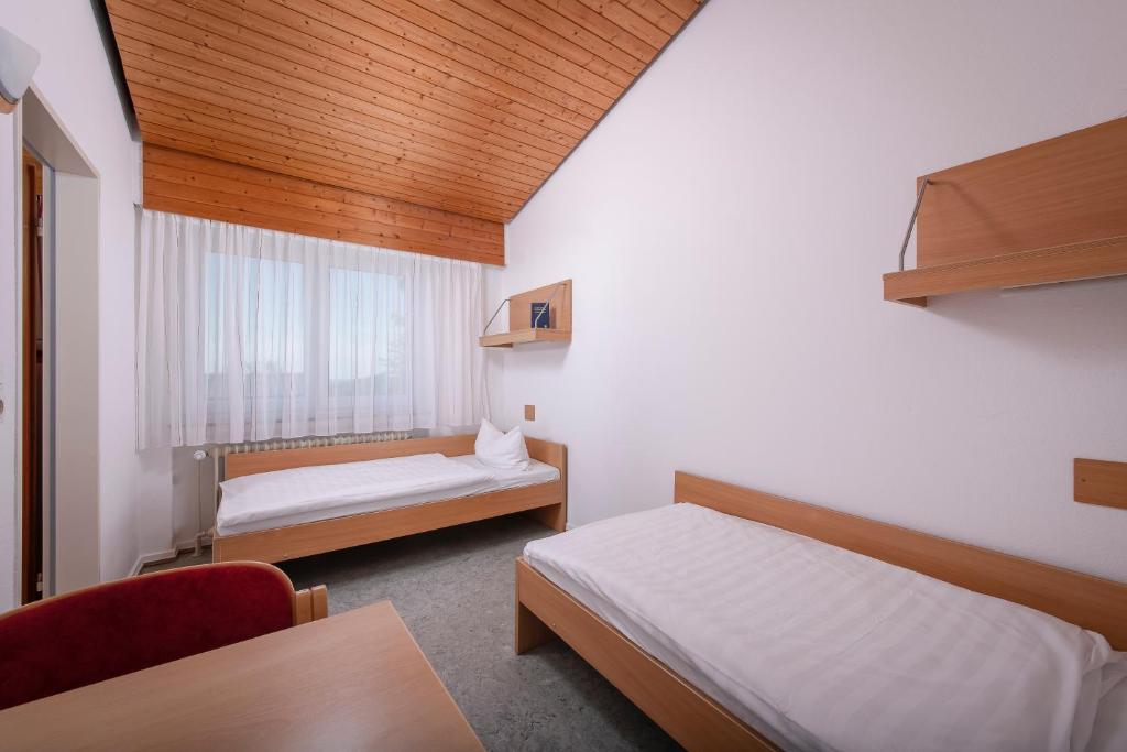 Postel nebo postele na pokoji v ubytování Ferienclub Maierhöfen