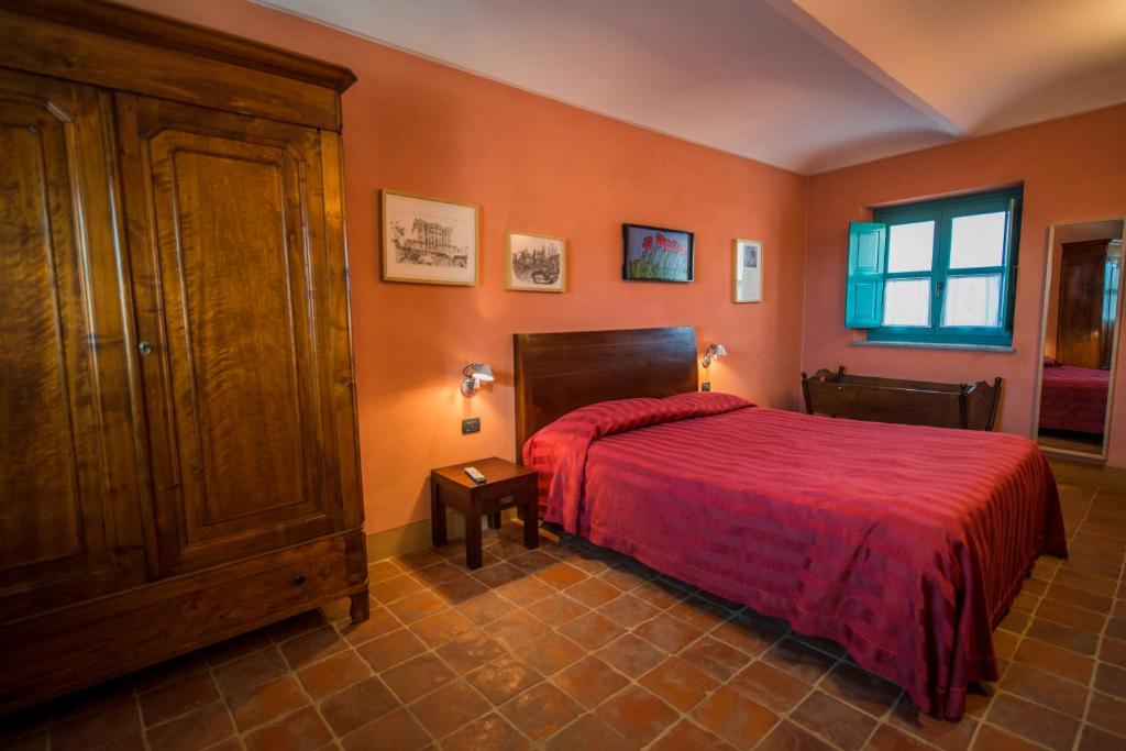 Postel nebo postele na pokoji v ubytování Albergo Ristorante Garibaldi