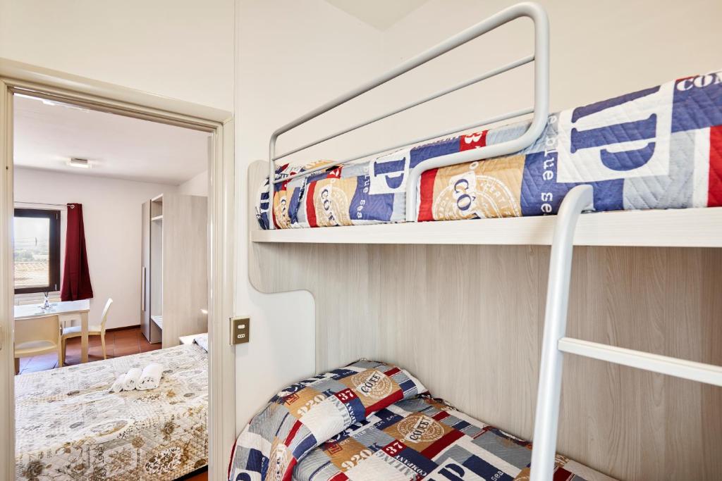 Posteľ alebo postele v izbe v ubytovaní Vacanze In Torre