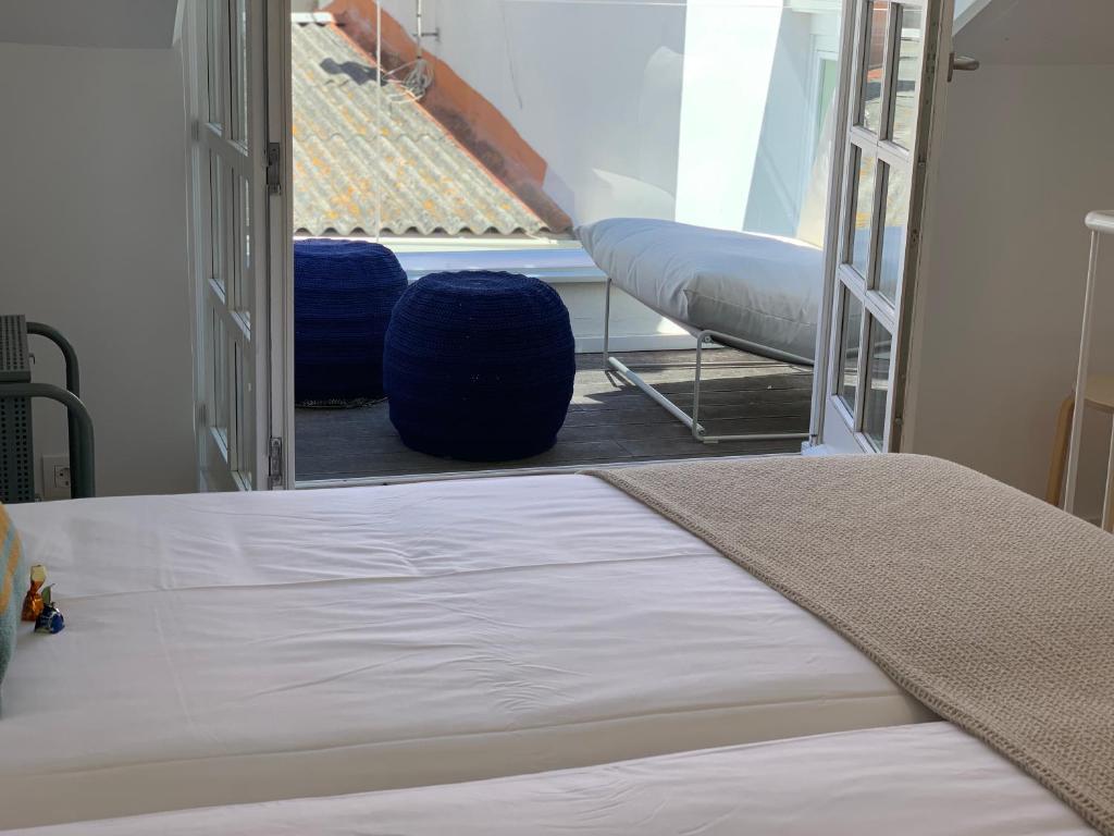 A bed or beds in a room at Oktheway Coruña Historic Center