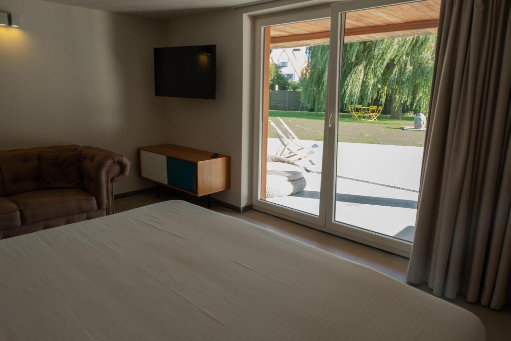 Postel nebo postele na pokoji v ubytování Villa Farfalla