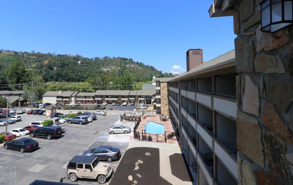 arial view of a parking lot next to a building at Howard Johnson by Wyndham Downtown Gatlinburg in Gatlinburg