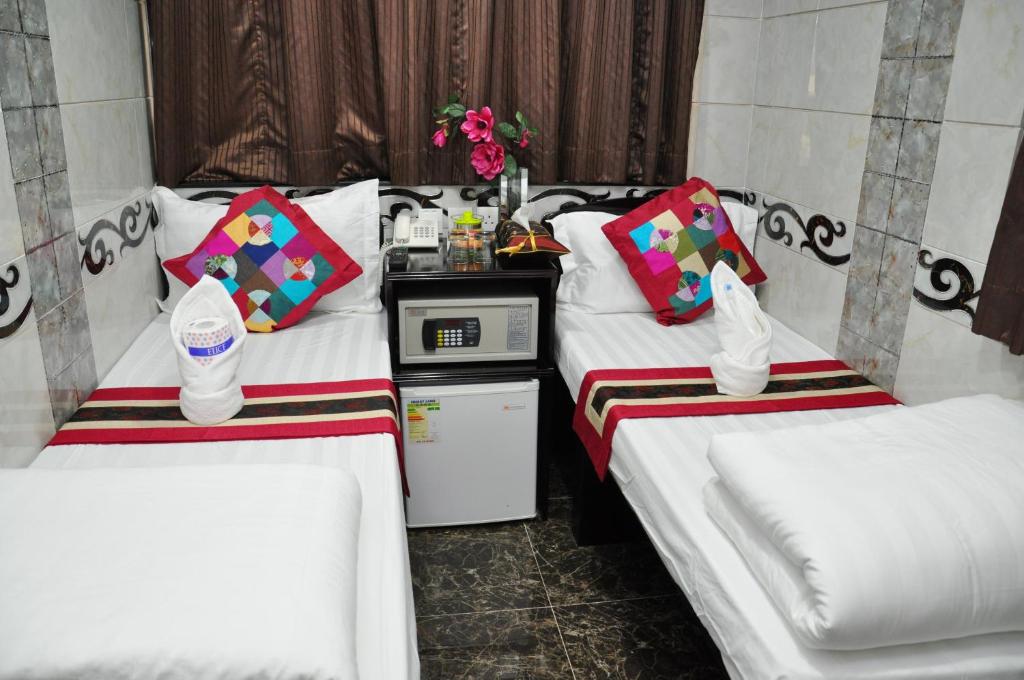 Postel nebo postele na pokoji v ubytování Pearl Premium Guest House(10/F)