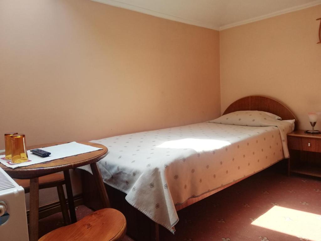 Postel nebo postele na pokoji v ubytování Family Hotel Bashtina Kashta