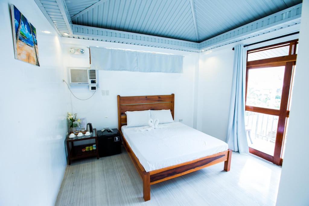 Postel nebo postele na pokoji v ubytování Siargao Home Sweet Home
