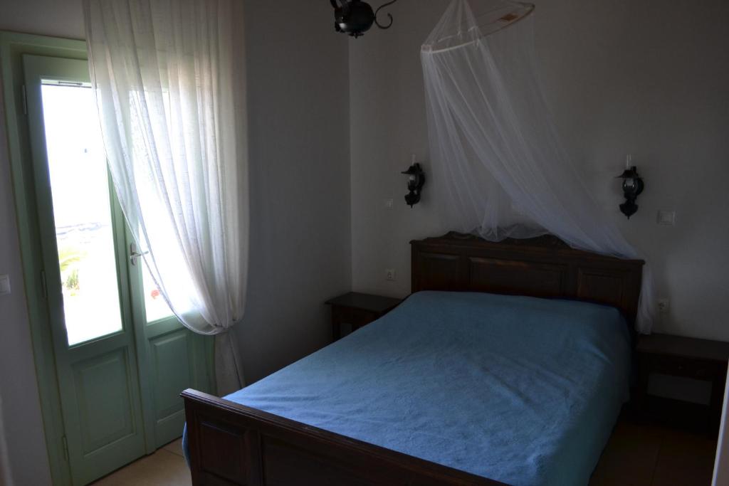 Postel nebo postele na pokoji v ubytování Villa Ioanna Tinos