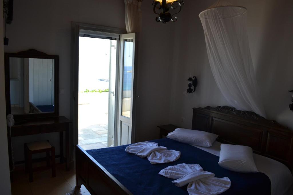 Postel nebo postele na pokoji v ubytování Villa Ioanna Tinos