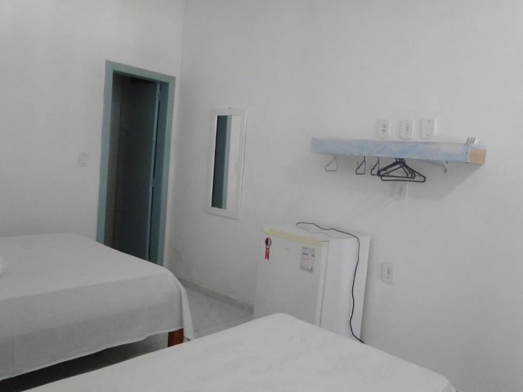 Postel nebo postele na pokoji v ubytování Pousada Vila Mar