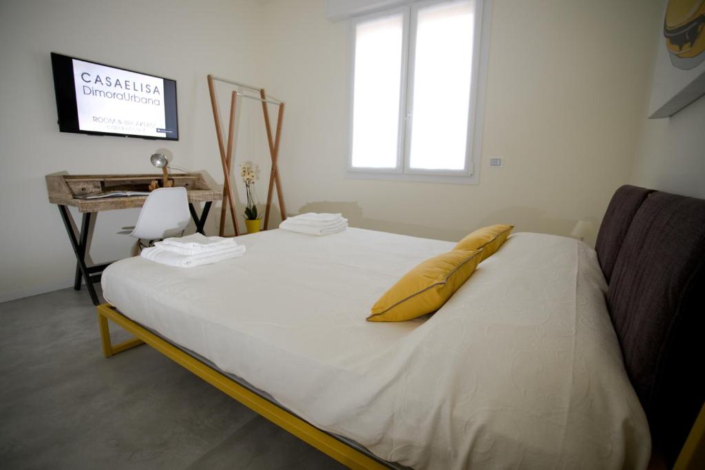 Postel nebo postele na pokoji v ubytování Casa Elisa Dimora Urbana