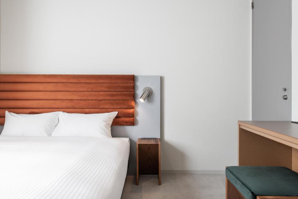 KIRO 広島 by THE SHARE HOTELS にあるベッド