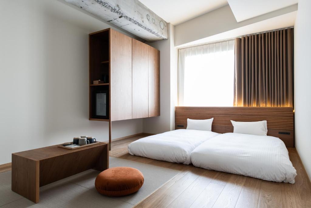 KIRO 広島 by THE SHARE HOTELS にあるベッド