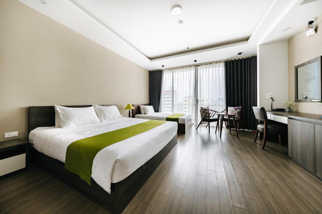 Postel nebo postele na pokoji v ubytování Hana 2 Apartment & Hotel Bac Ninh