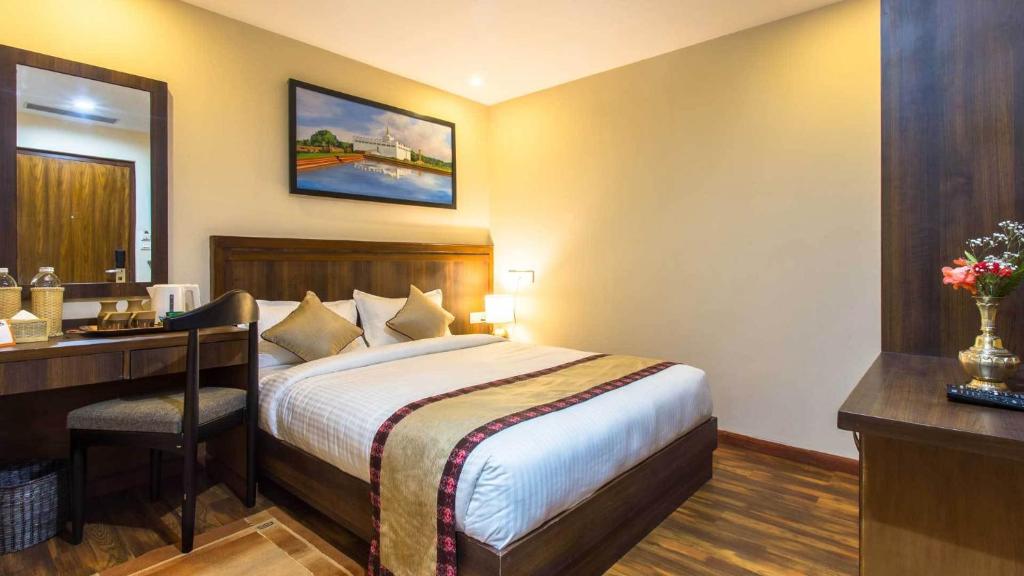 Postel nebo postele na pokoji v ubytování Hotel Kutumba