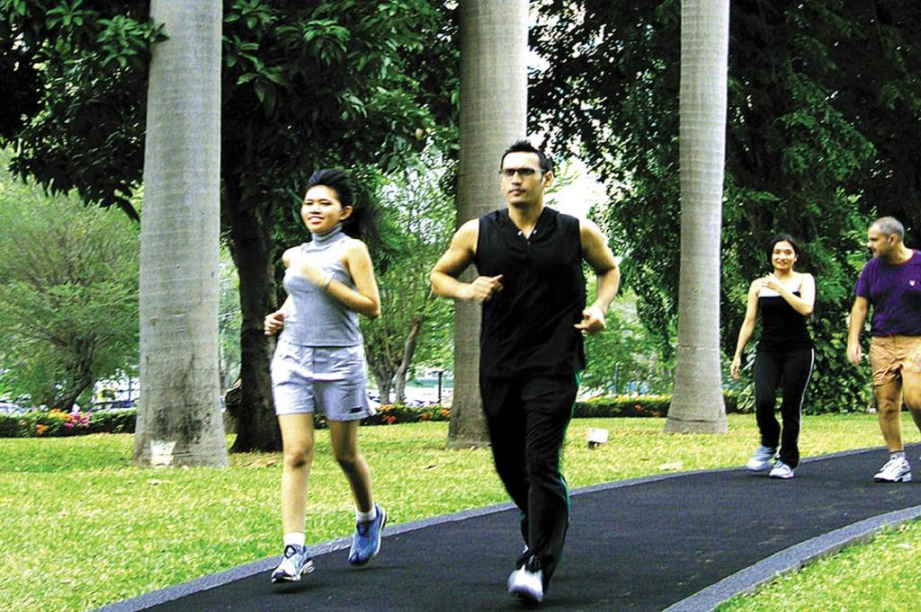 a group of people running in a park at Hotel Borobudur Jakarta in Jakarta