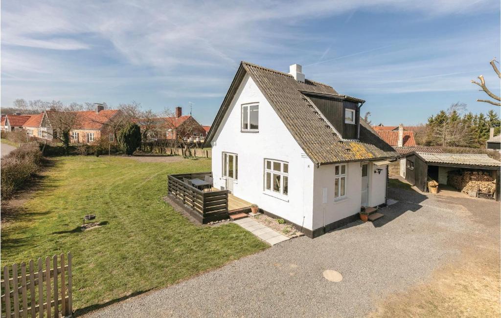 an aerial view of a white house with a yard at Two-Bedroom Holiday Home In Gudhjem in Gudhjem
