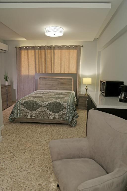 Postel nebo postele na pokoji v ubytování Itza-Bella Suites
