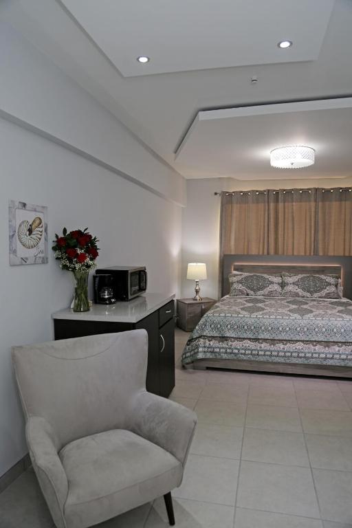 Postel nebo postele na pokoji v ubytování Itza-Bella Suites