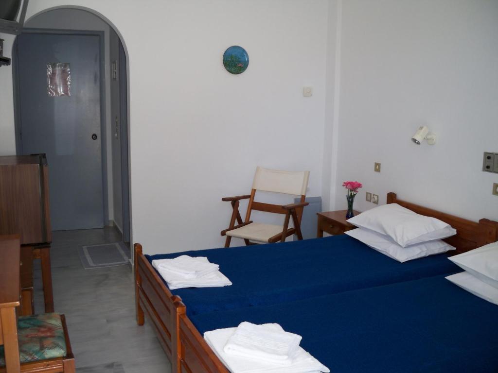 Postel nebo postele na pokoji v ubytování Heracles Hotel