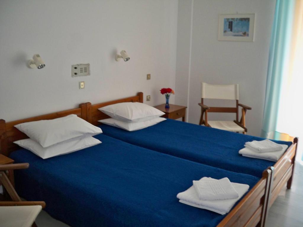 Postel nebo postele na pokoji v ubytování Heracles Hotel