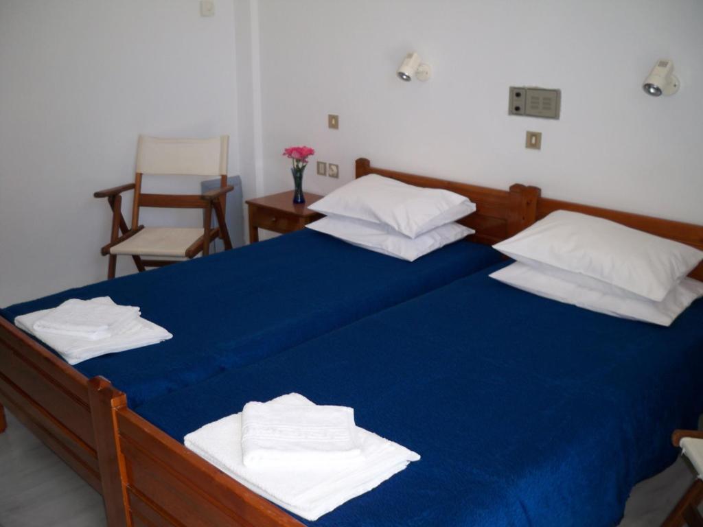 Postel nebo postele na pokoji v ubytování Heracles Hotel