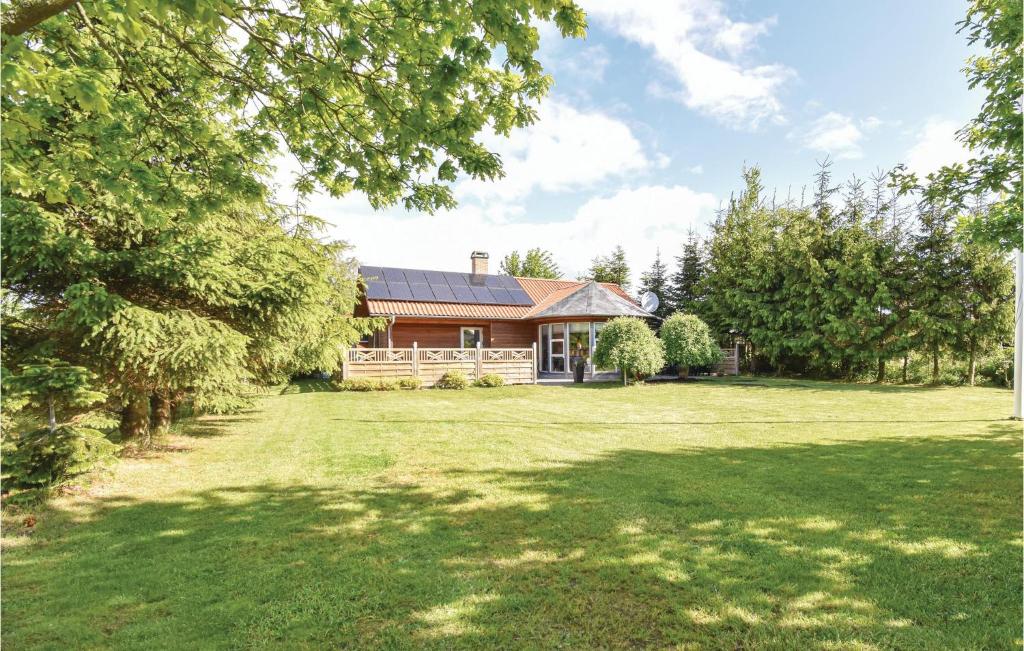 a house with a large yard in front of it at Four-Bedroom Holiday Home In Middelfart in Middelfart