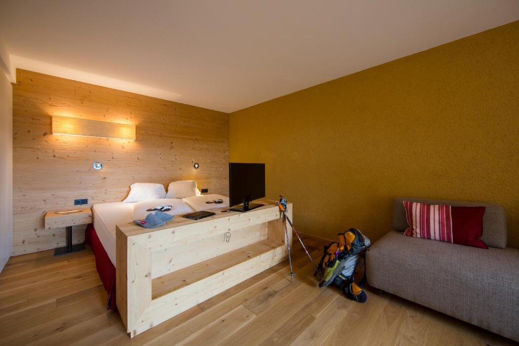Postel nebo postele na pokoji v ubytování Hotel Dolomitenblick