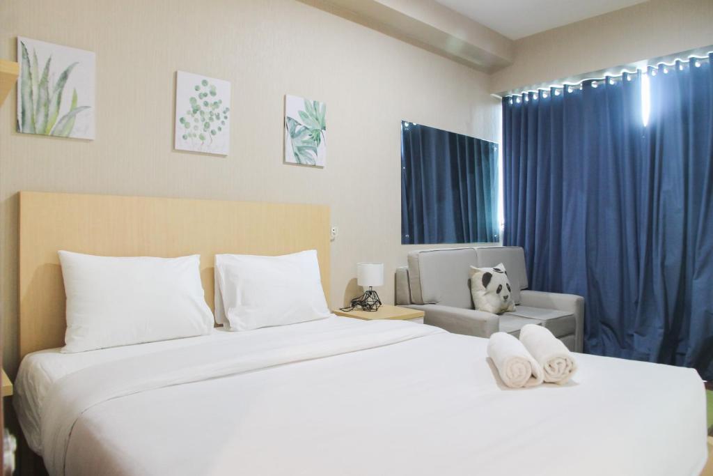 Cozy 1BR Apartment Grand Kamala Lagoon By Travelio - Housity