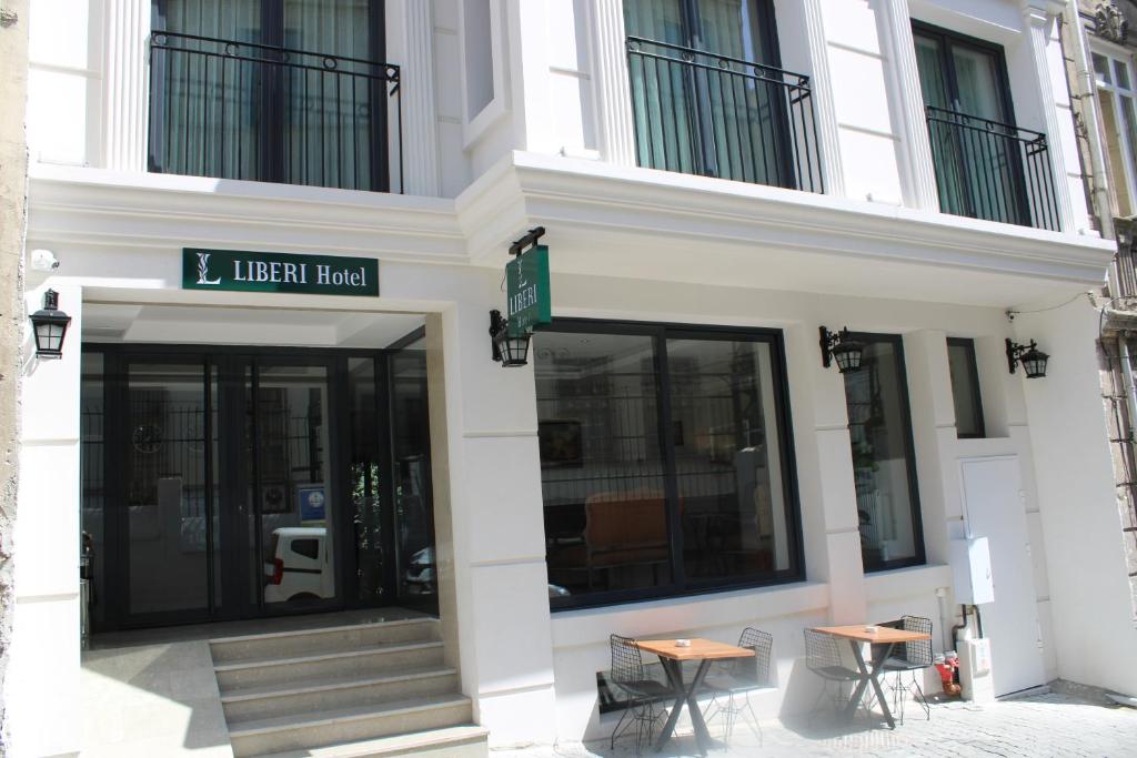 a building with two tables in front of it at Liberi Hotel Taksim in Istanbul
