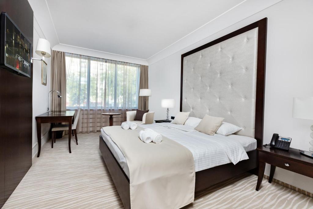 Postel nebo postele na pokoji v ubytování GARNI HOTEL AMI