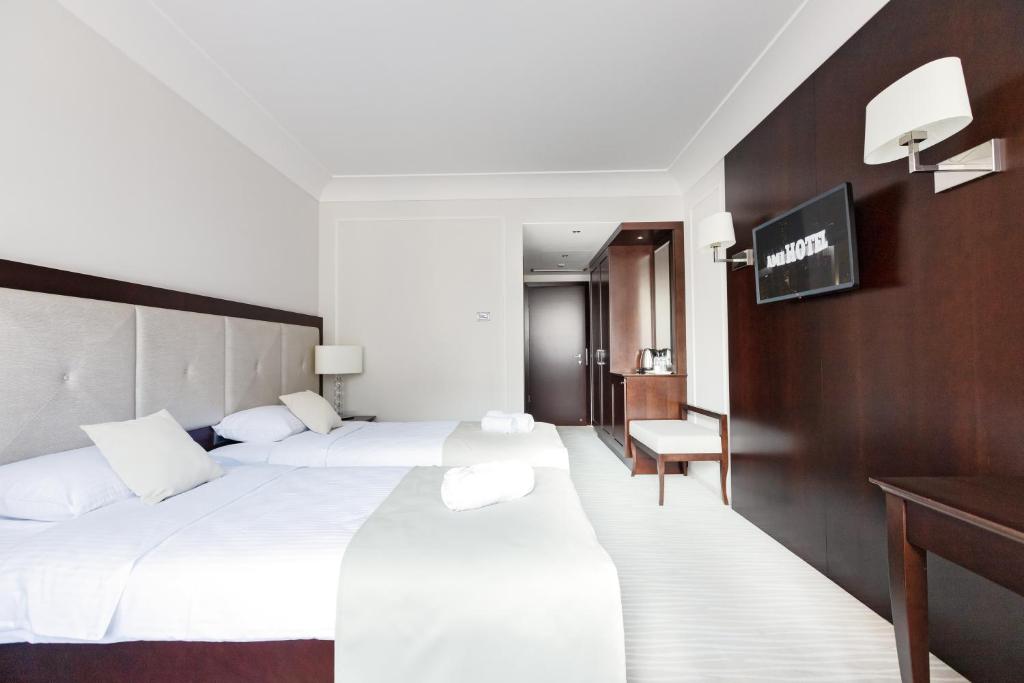 Postel nebo postele na pokoji v ubytování GARNI HOTEL AMI