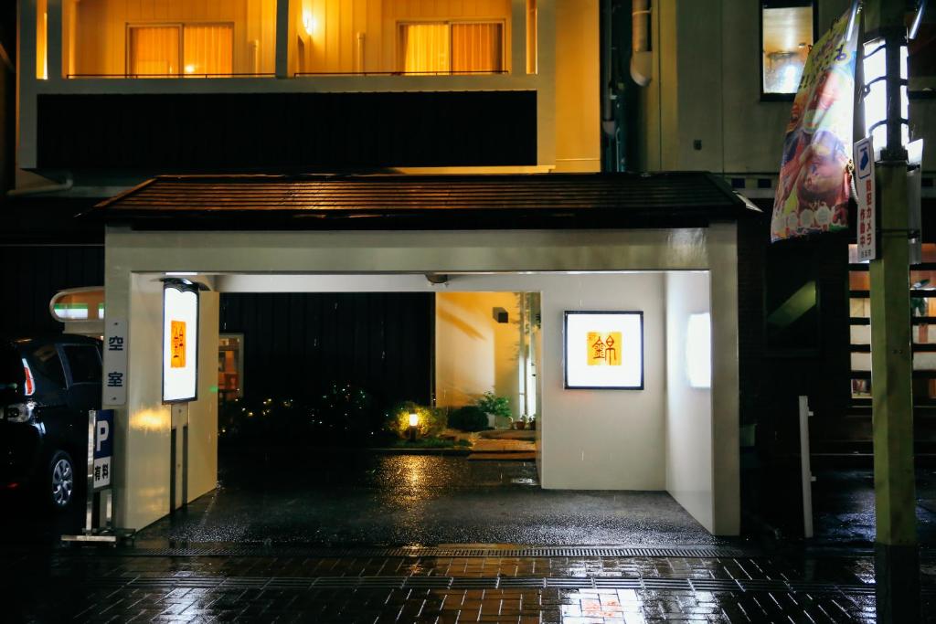 an entrance to a building at night at Shinnishiki Hotel in Shirahama