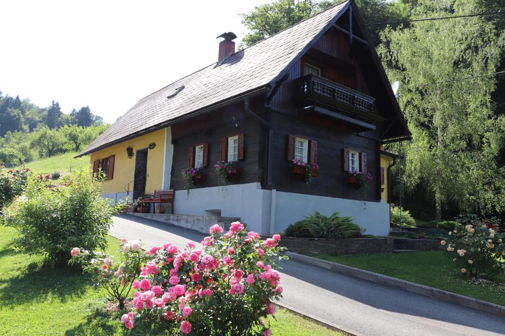 a small house with flowers in front of it at Ferienhaus Aurelia in Kitzeck im Sausal