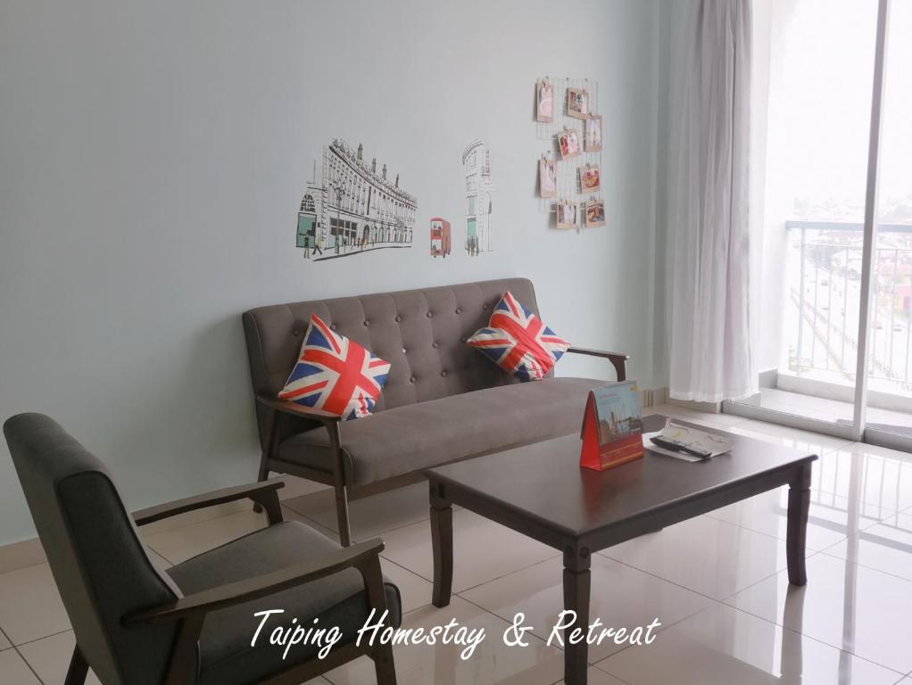 A seating area at Taiping Centre Point Suite 10 by BWC