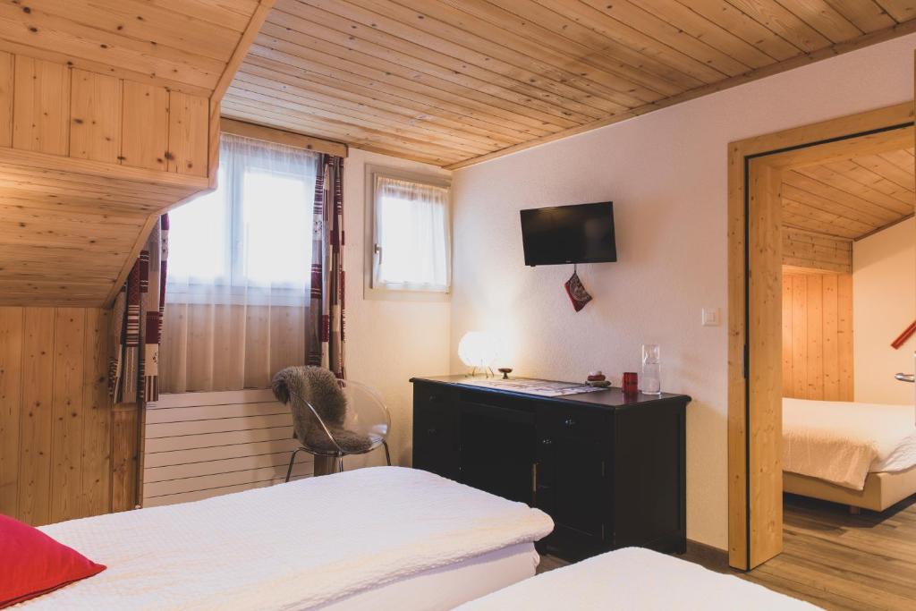 Postel nebo postele na pokoji v ubytování Pointe de Zinal