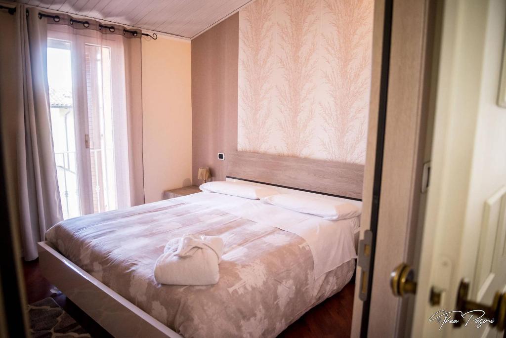 Postel nebo postele na pokoji v ubytování Hotel Lonatino