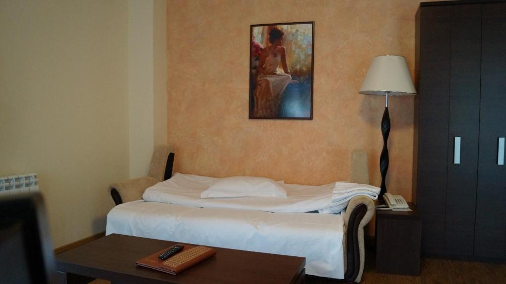 Postel nebo postele na pokoji v ubytování Hotel Bucegi