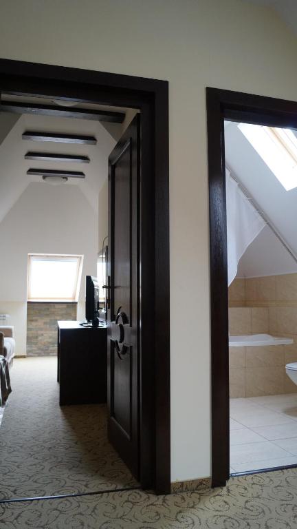 Postel nebo postele na pokoji v ubytování Hotel Bucegi