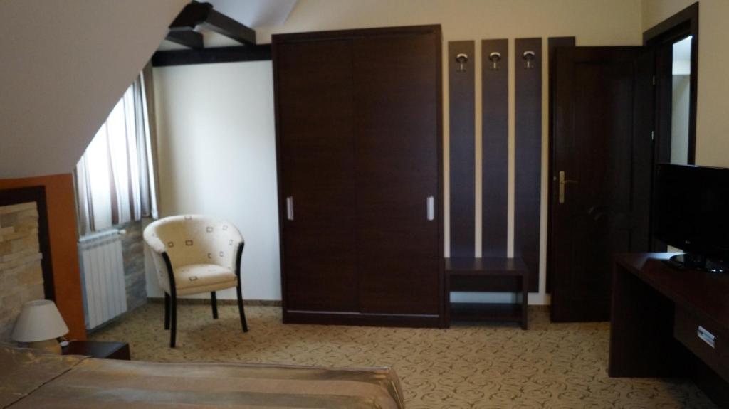 TV a/nebo společenská místnost v ubytování Hotel Bucegi