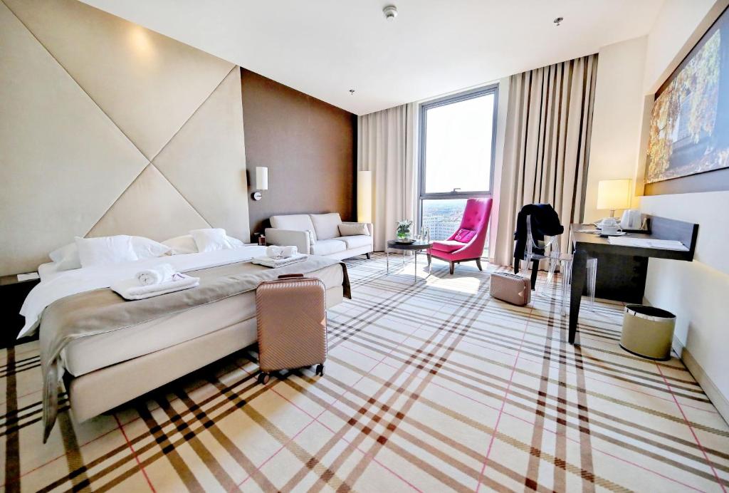 Postel nebo postele na pokoji v ubytování Hotel Rzeszów