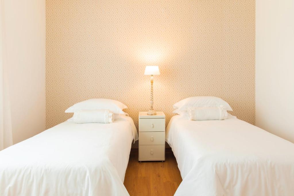 Postel nebo postele na pokoji v ubytování Hostel da Palmeira