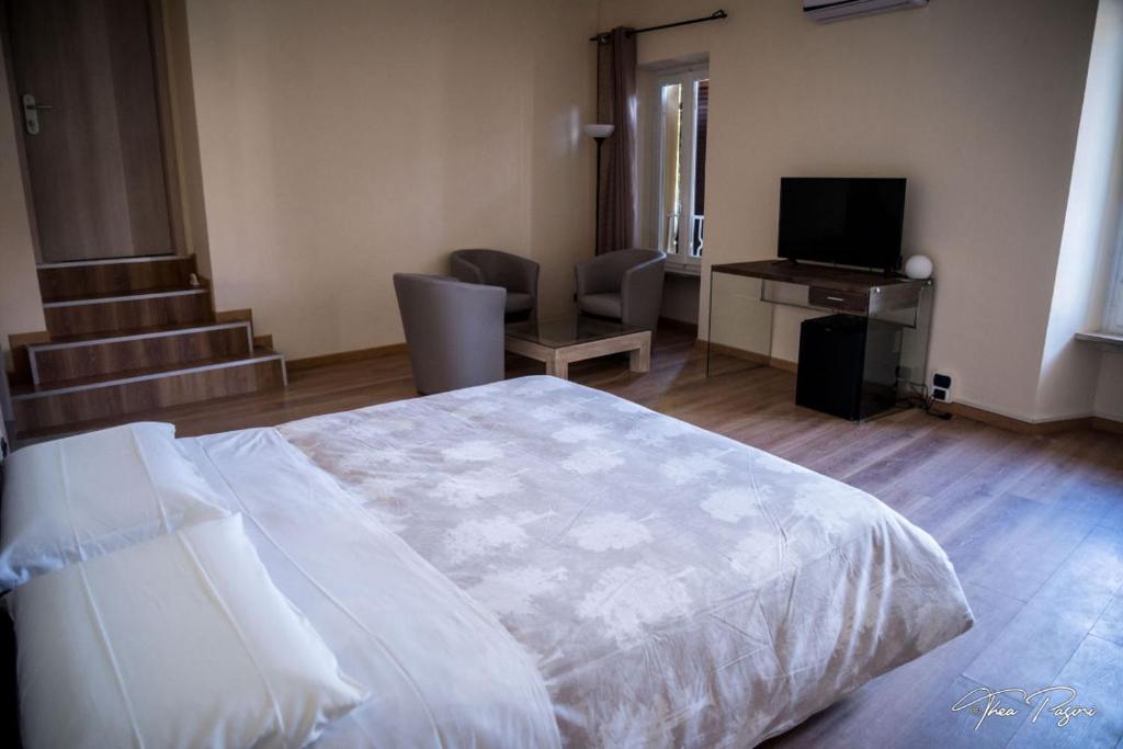 Postel nebo postele na pokoji v ubytování Hotel Lonatino