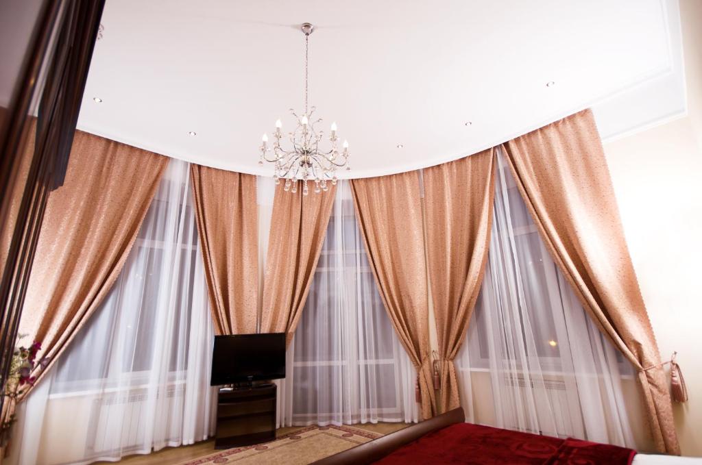 TV a/nebo společenská místnost v ubytování Ekaterina Hotel