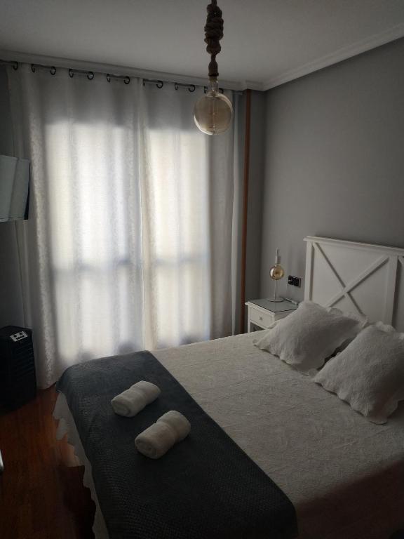 A bed or beds in a room at Apartamento Edificio Plaza Gran Vía