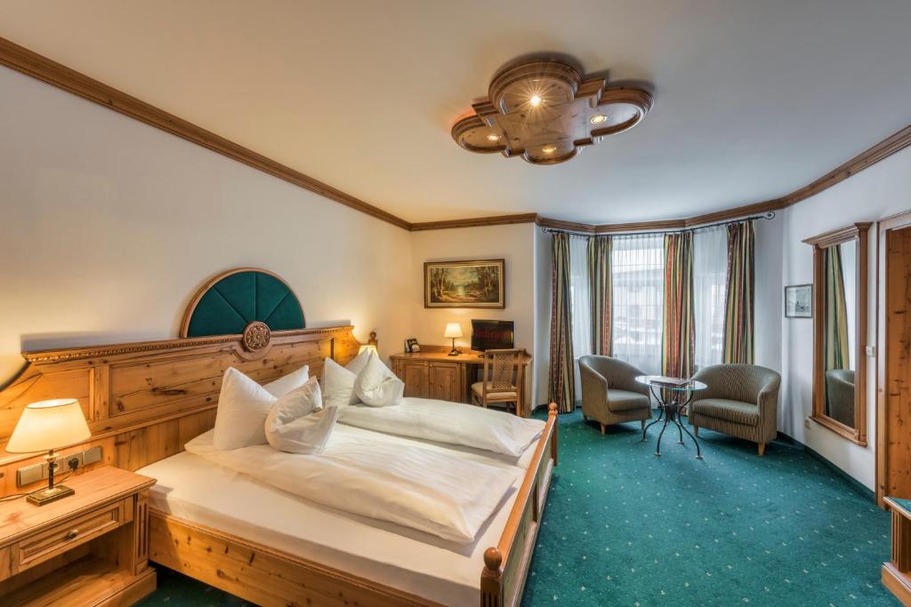 Postel nebo postele na pokoji v ubytování Hotel Unterwirt