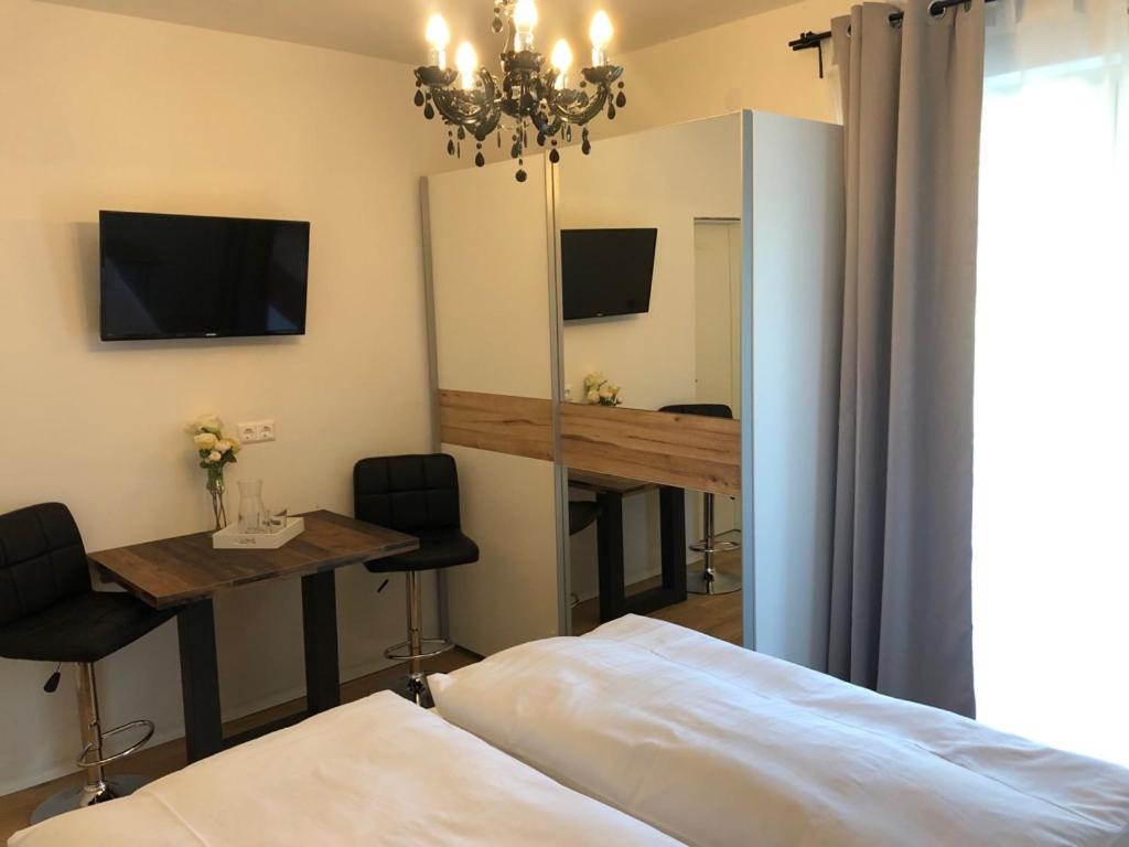 Televízia a/alebo spoločenská miestnosť v ubytovaní Enjoyit Velden West